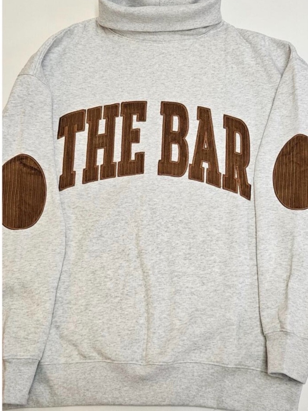 The Bar Light Gray Turtleneck Sweater with Brown Appliqué